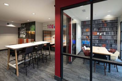 Academic lounge with large table and private study room