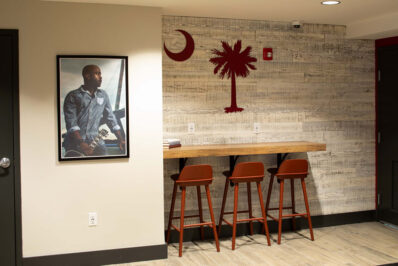 Small coffee bar with red chairs