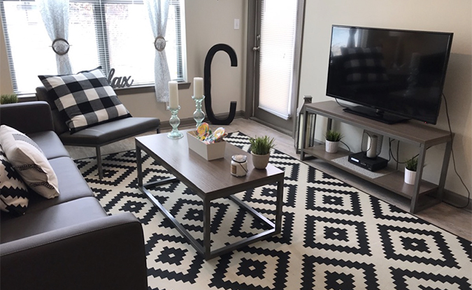 Apartment living room featuring a tv and couch
