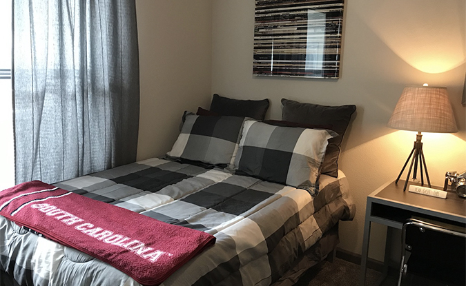 Apartment bedroom featuring bed