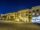 Night time view of yellow apartment buildings