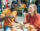 two young adults eating burgers