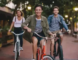 young adults riding bikes